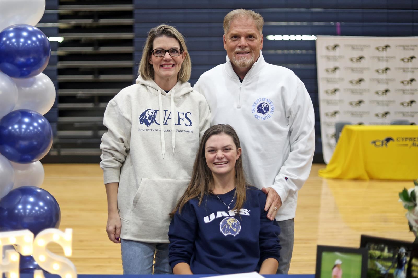Cypress Ranch High School senior Lauren Evans, seated, signed her letter of intent to the University of Arkansas-Fort Smith. 